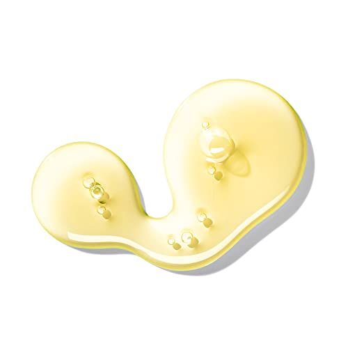 Gelbe Flüssigkeit, vermutlich Seife, auf weißem Hintergrund. Einige Blasen sind sichtbar.