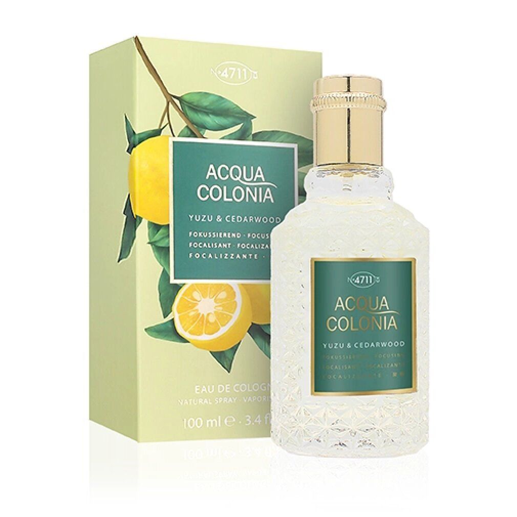 Flasche und Verpackung von '4711 Acqua Colonia Yuzu & Cedarwood'. Flakon mit Reliefmuster, goldfarbenem Verschluss. Karton mit Zitronenmotiv.