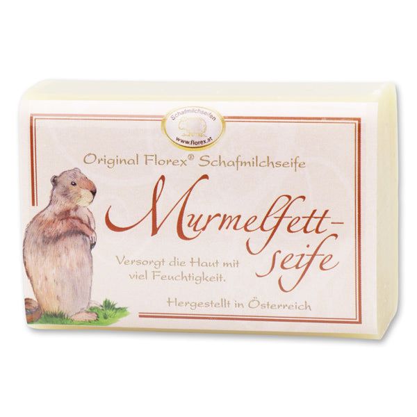 Rechteckige Seife mit Etikett. Aufschrift: Original Florex Schafmilchseife Murmelfettseife. Abbildung eines Murmeltiers.