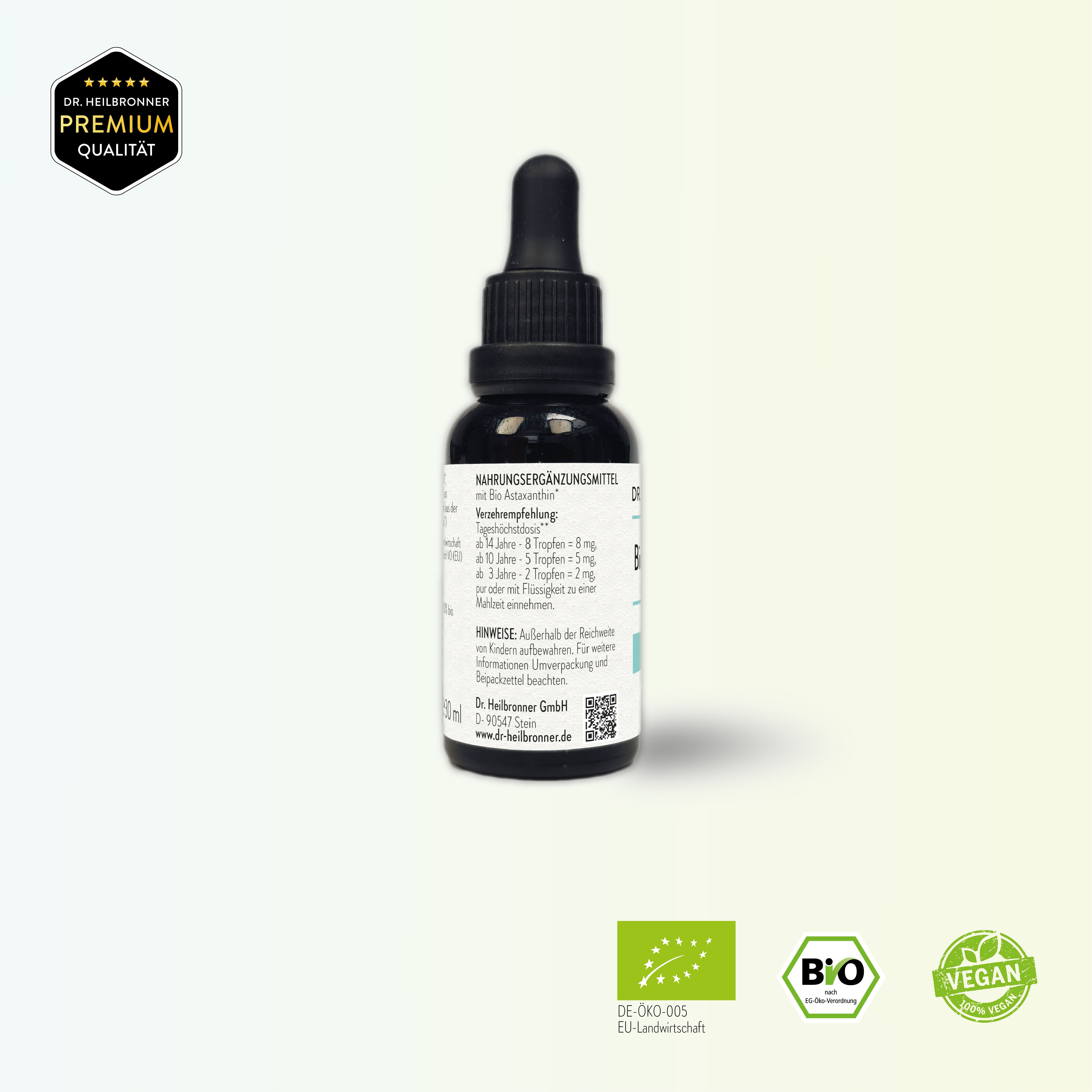 Braune Glasflasche mit schwarzem Tropfer. Beschriftung: Bio Astaxanthin Liquid. Bio-Siegel, Vegan-Siegel. Premium Qualität.