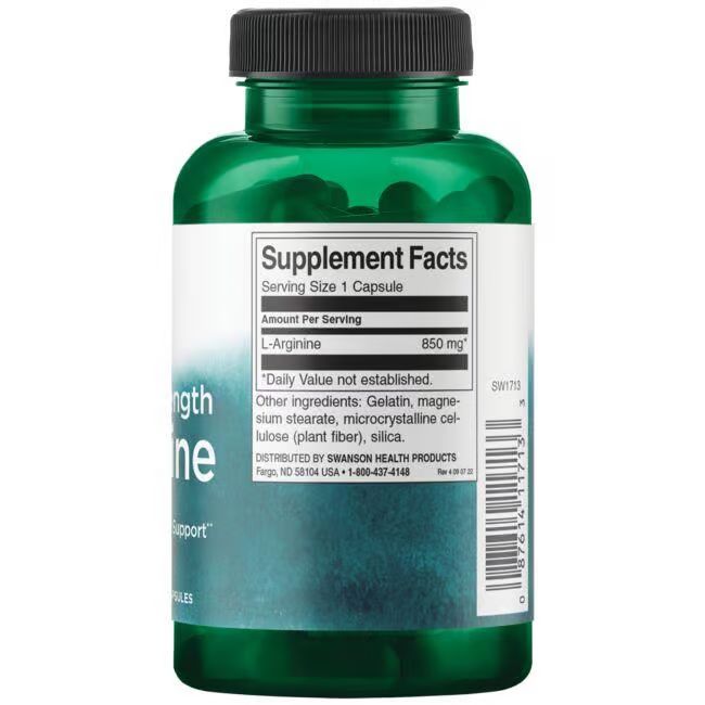 Rückseite einer grünen Flasche. Etikett mit Nährwertangaben: L-Arginin 850 mg. Weitere Inhaltsstoffe und Herstellerinformationen.