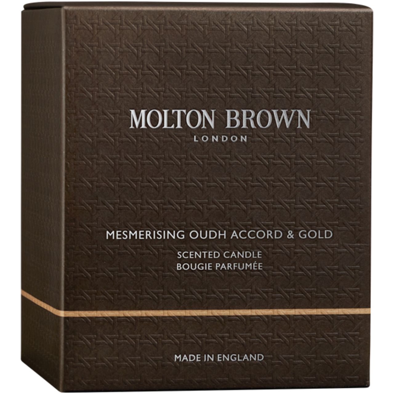 Braune Verpackung mit Prägemuster. Aufschrift: Molton Brown London, Mesmerising Oudh Accord & Gold, Scented Candle, Made in England.