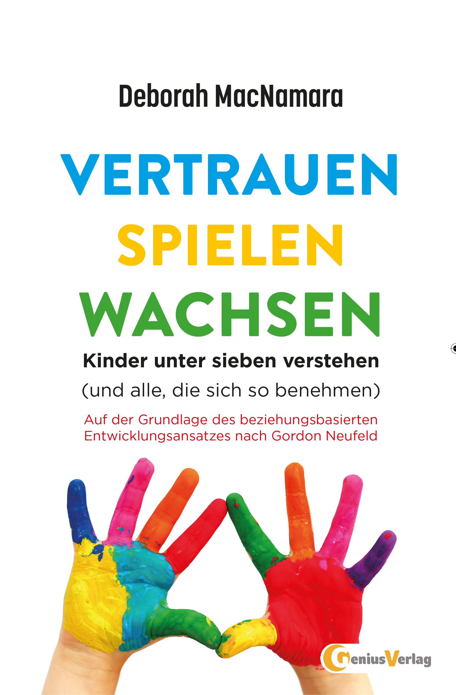 Buchcover mit Titel "VERTRAUEN SPIELEN WACHSEN". Autorin: Deborah MacNamara. Zwei Hände, bemalt mit Regenbogenfarben, bilden ein Herz.