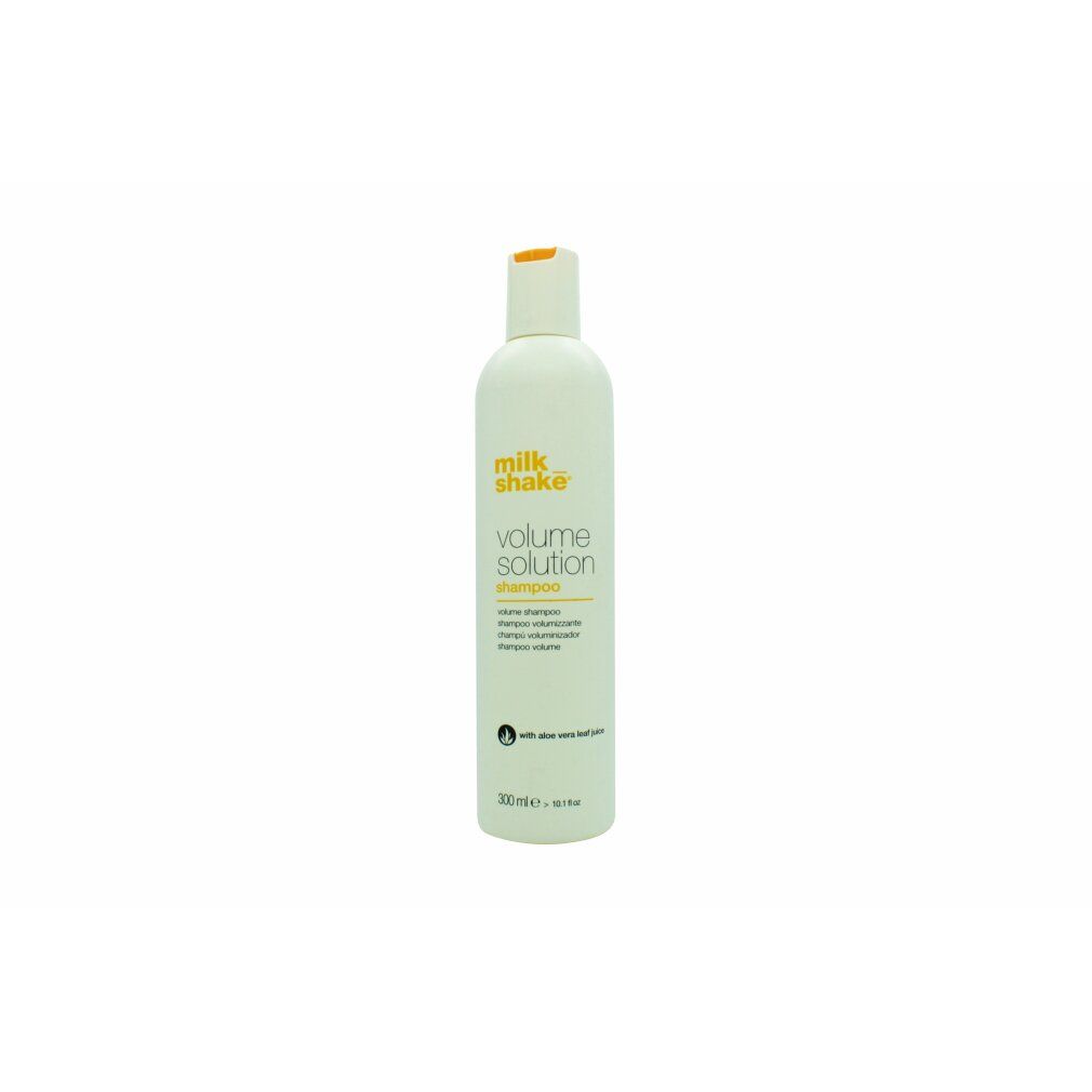 Weiße Flasche mit gelbem Etikett, "milk_shake volume solution shampoo" aufgedruckt.