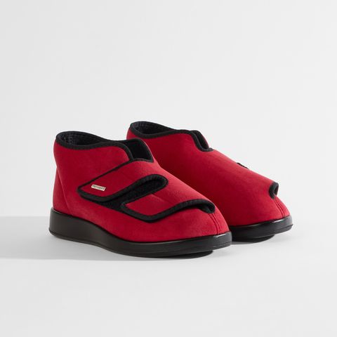 Roter Schuh mit Klettverschluss, geöffnet, um das Innere zu zeigen. Etikett "Varomed" sichtbar.