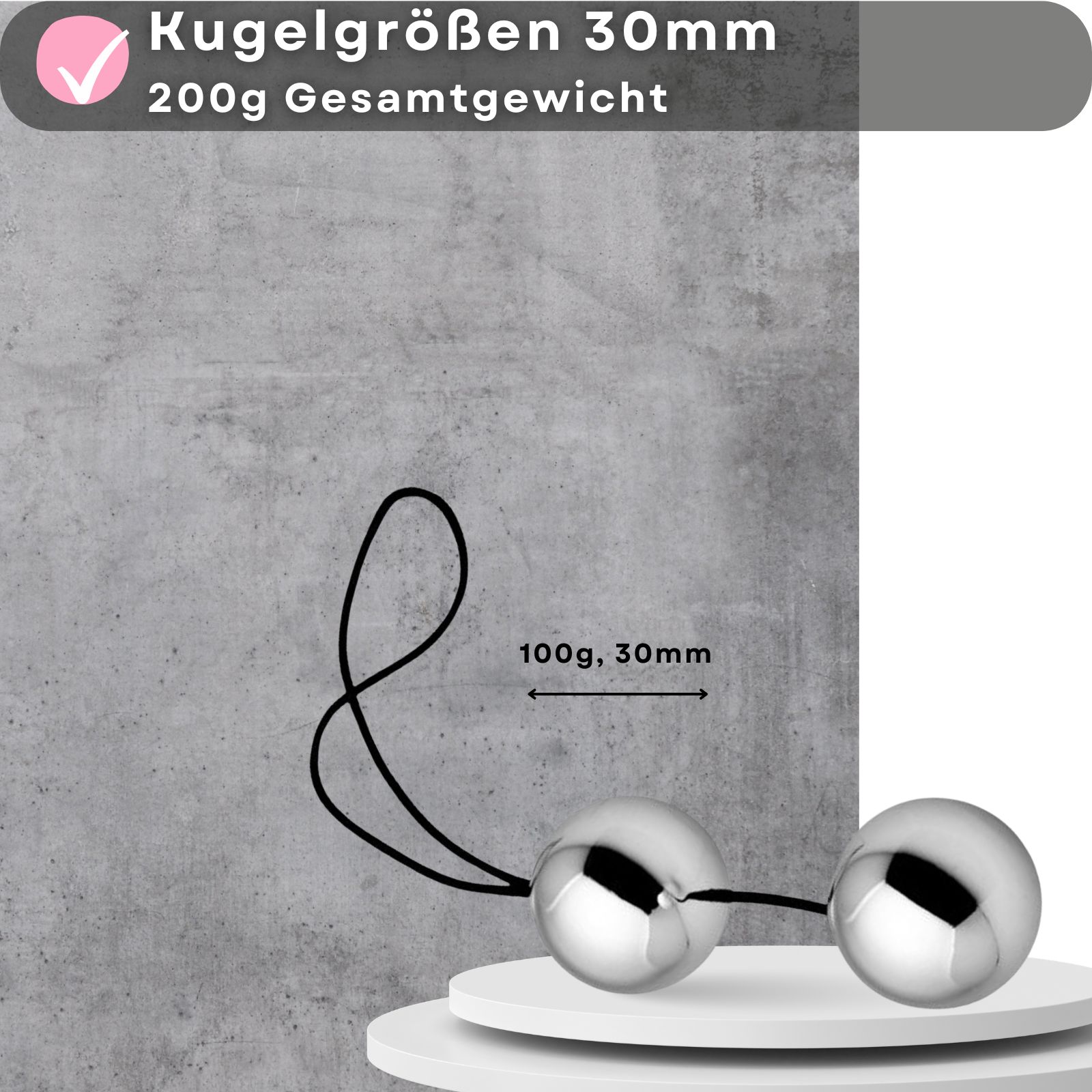 Zwei silberfarbene Kugeln mit schwarzem Band. Aufschrift: 100g, 30mm.