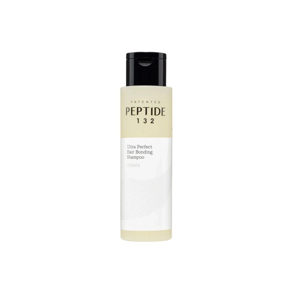 COSRX Peptide-132 Shampoo-Flasche. Weiß-beige Flasche mit schwarzem Deckel. Text: Peptide 132, Ultra Perfect Hair Bonding Shampoo.