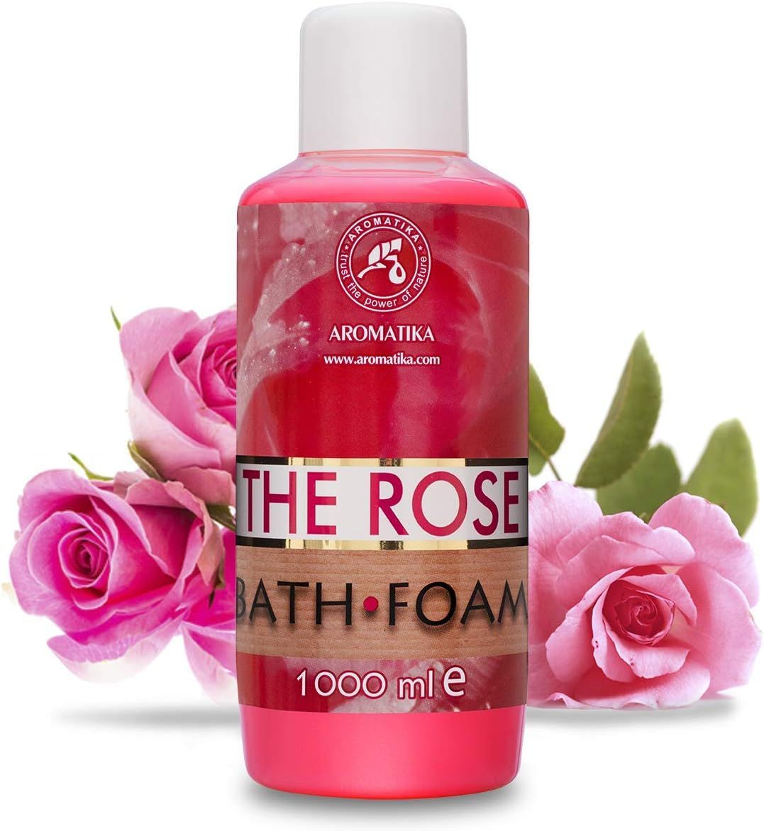 Rosa Badeschaum-Flasche mit weißem Deckel. Aufschrift: AROMATIKA, THE ROSE BATH FOAM, 1000 ml. Rosen und Blätter im Hintergrund.