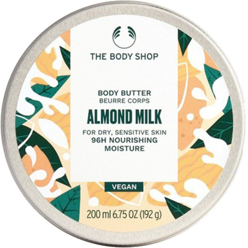 Runde Dose mit Deckel. Aufschrift: The Body Shop, Body Butter Almond Milk. Für trockene, empfindliche Haut. Vegan. 200 ml.