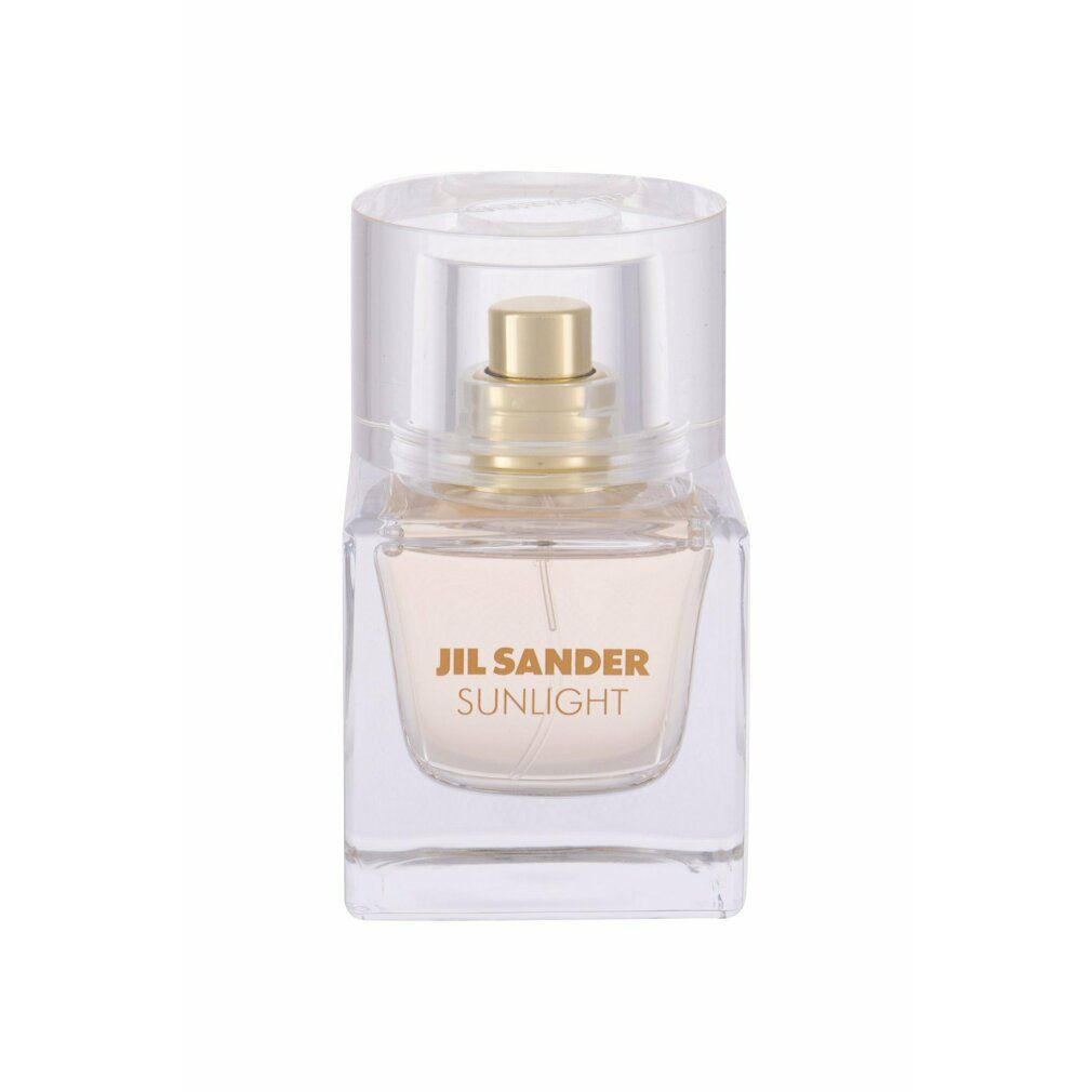Jil Sander Sunlight Parfümflakon. Kleiner quadratischer Glasflakon mit goldfarbenem Zerstäuber und Deckel. Schriftzug Sunlight.