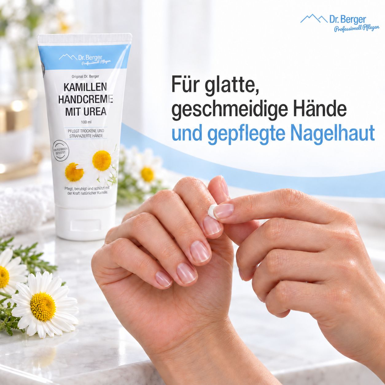 Dr. Berger Kamillen Handcreme mit Urea Tube neben Händen, die eingecremt werden.