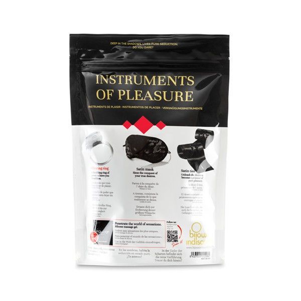 Verpackung mit Produkten. Enthält eine Augenmaske, einen Vibrationsring und ein schwarzes Accessoire. Text und Illustrationen.