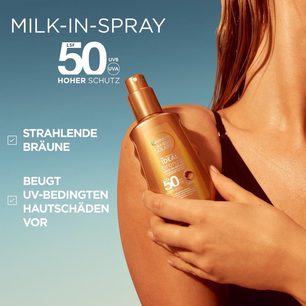Garnier Ambre Solaire Milk-in-Spray 50. Flasche wird auf Schulter gesprüht. Text: LSF 50, hoher Schutz, strahlende Bräune, beugt UV-Schäden vor.