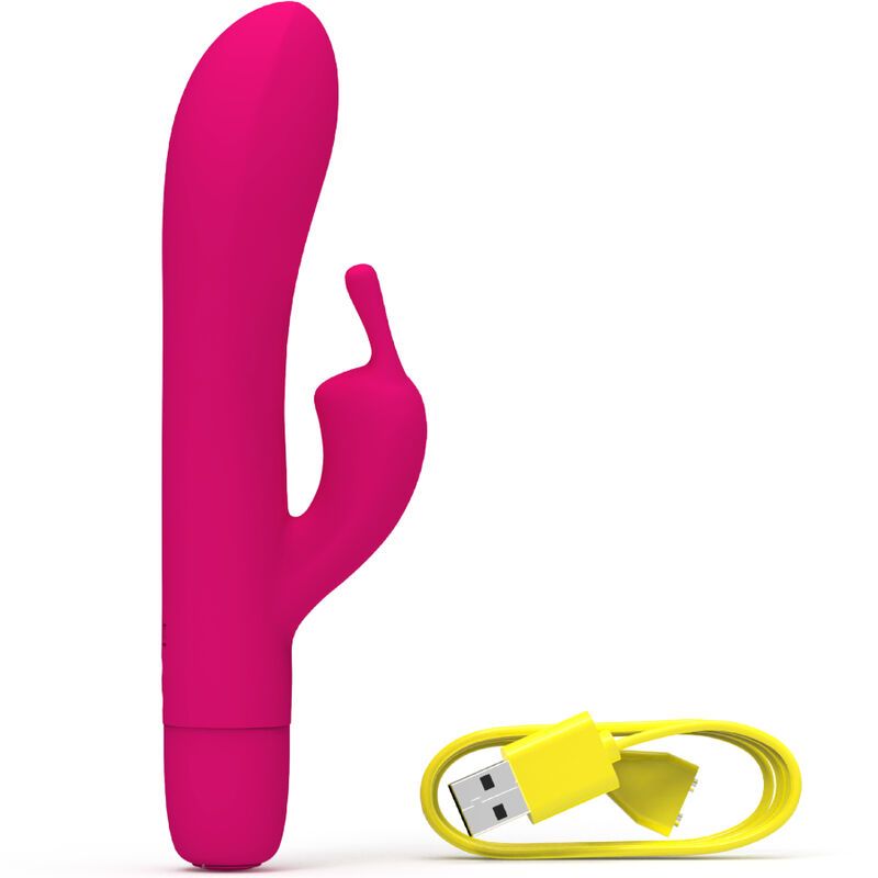 Pinker Vibrator und gelbes Ladekabel. Produktname: B Swish. Vibrator mit Kaninchenform und zwei Vorsprüngen.