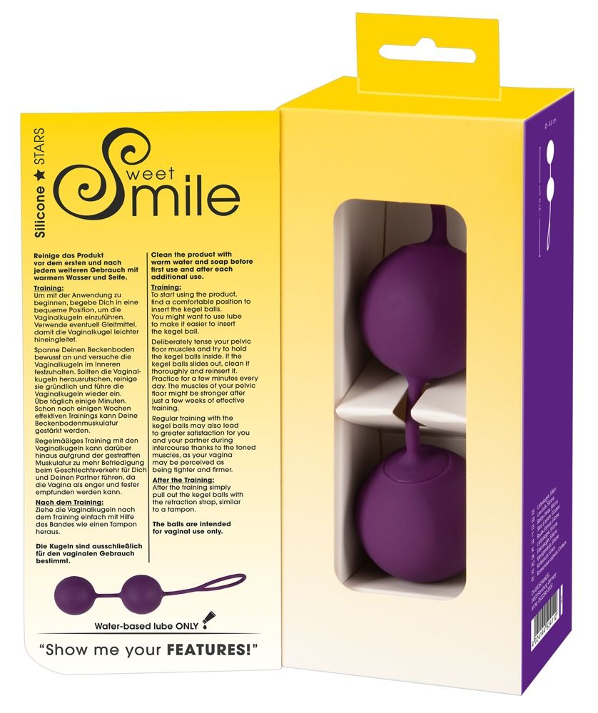 Verpackung mit zwei violetten Kugeln, verbunden durch einen Steg, mit Schlaufe. Text: Sweet Smile, Silicone Stars.