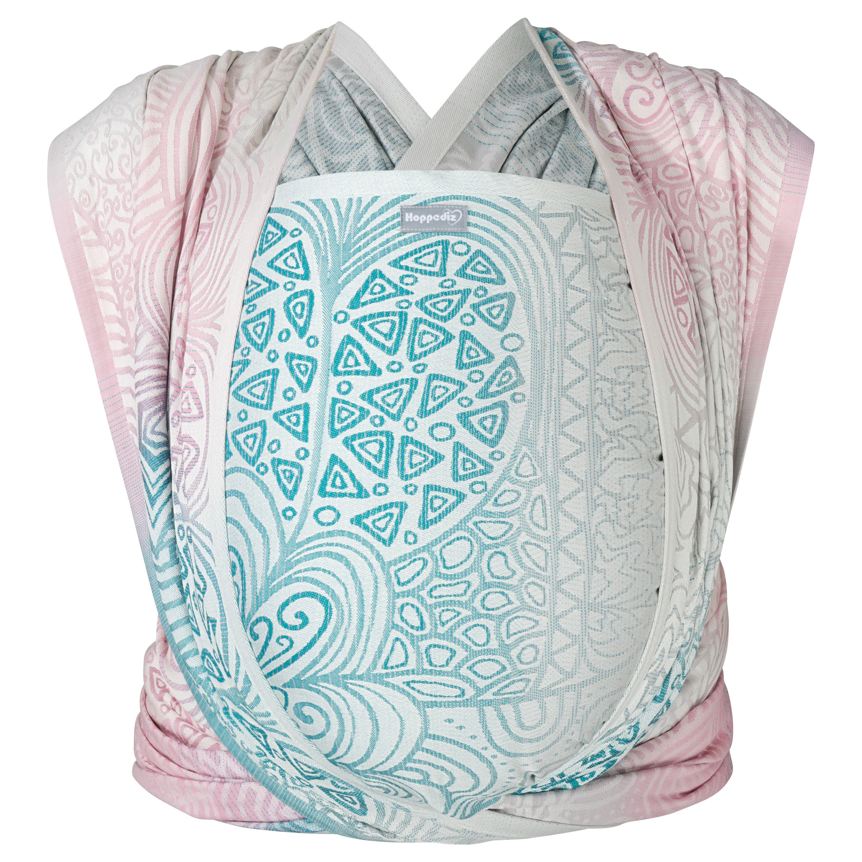 Tragetuch mit Muster in Rosa, Türkis und Weiß. Gewebtes Tuch mit floralen und geometrischen Mustern. kbA-Zertifizierung.