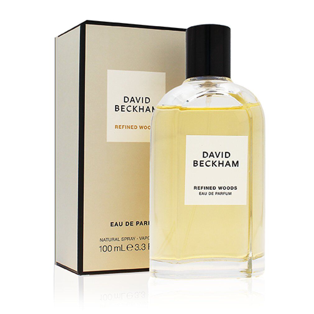 Parfümflasche und Verpackung mit "DAVID BECKHAM REFINED WOODS"-Etikett und Text.