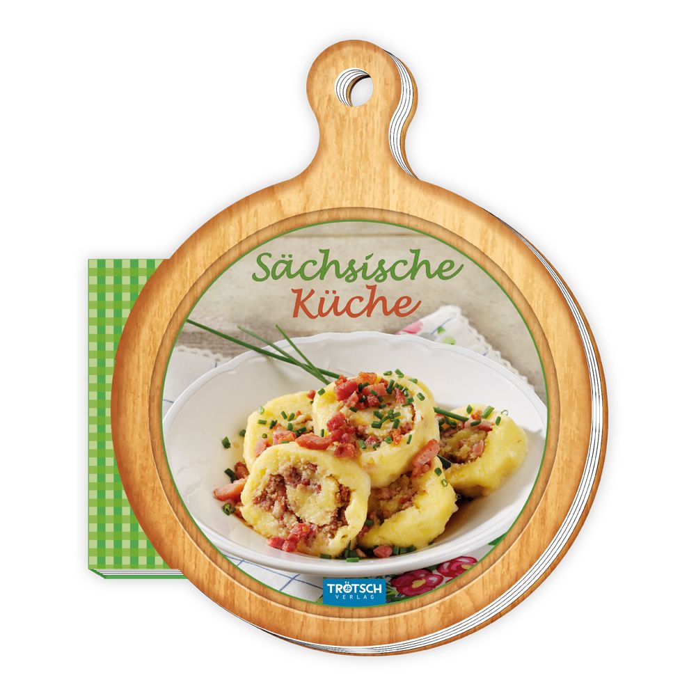 Kochbuch "Sächsische Küche" auf Holzbrett. Titel in grüner Schrift. Gericht auf Teller. Logo "Trötsch Verlag".