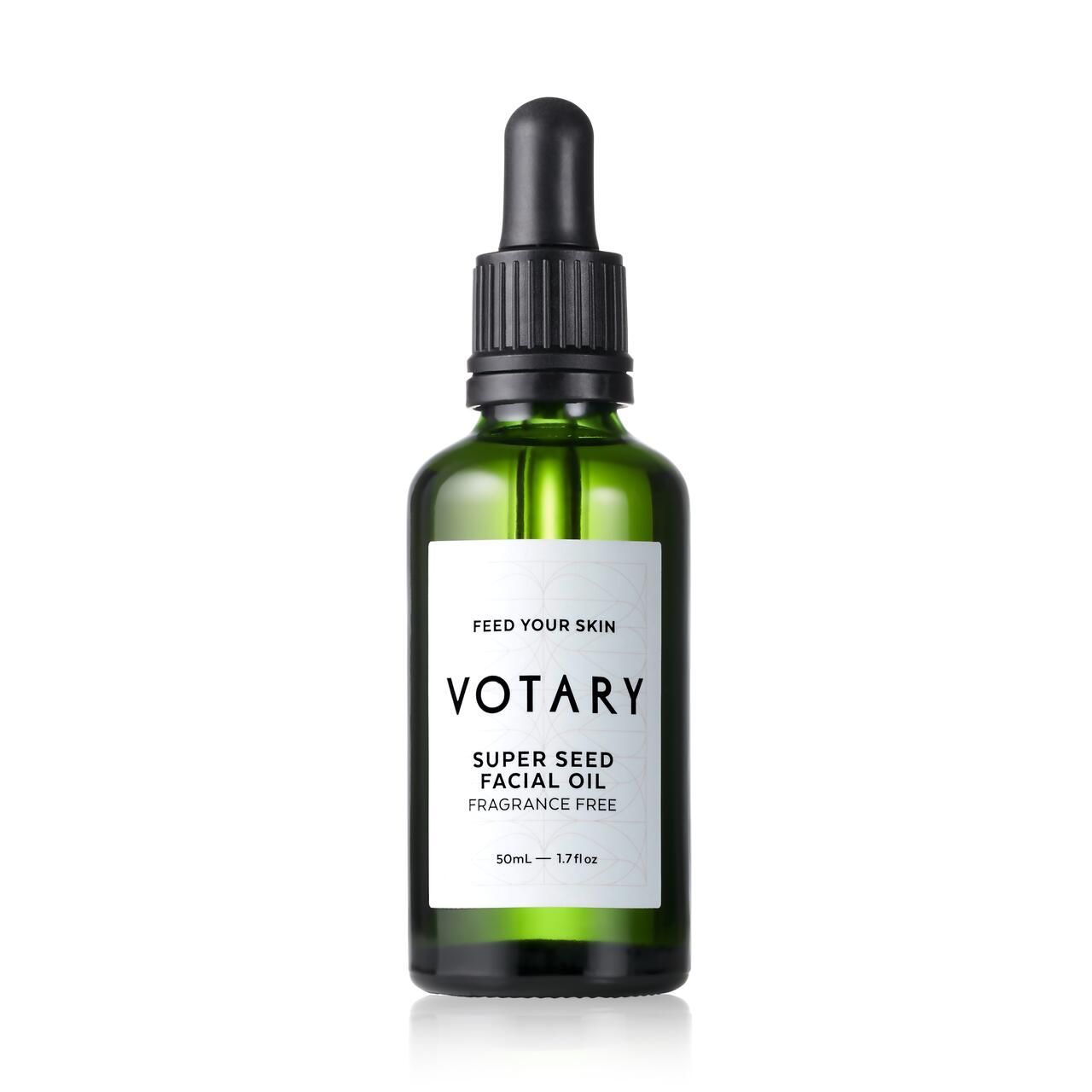 Grüne Glasflasche mit schwarzem Tropfer. Etikett mit "Votary Super Seed Facial Oil Fragrance Free".