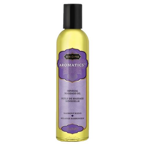 Flasche mit Massageöl. Lila Etikett mit Text: Aromatics, Sensual Massage Oil, Harmony Blend. Schwarzer Deckel.