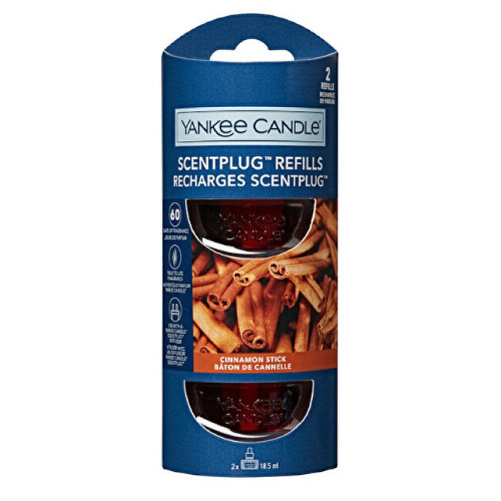 Zwei Nachfüllpackungen in einer blauen Verpackung. Aufschrift: Yankee Candle Scentplug Nachfüllungen. Bild von Zimtstangen.