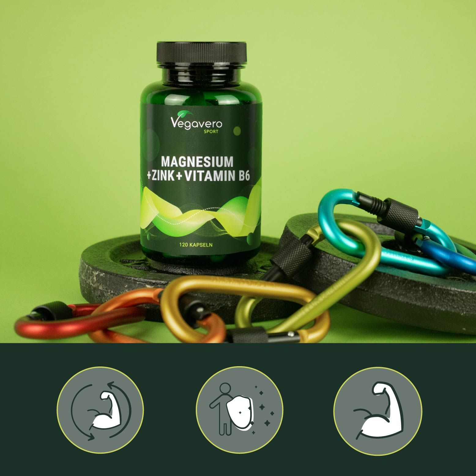 Grüne Flasche mit schwarzem Deckel. Aufschrift: Magnesium + Zink + Vitamin B6. 120 Kapseln. Karabinerhaken und Gewichte im Hintergrund.