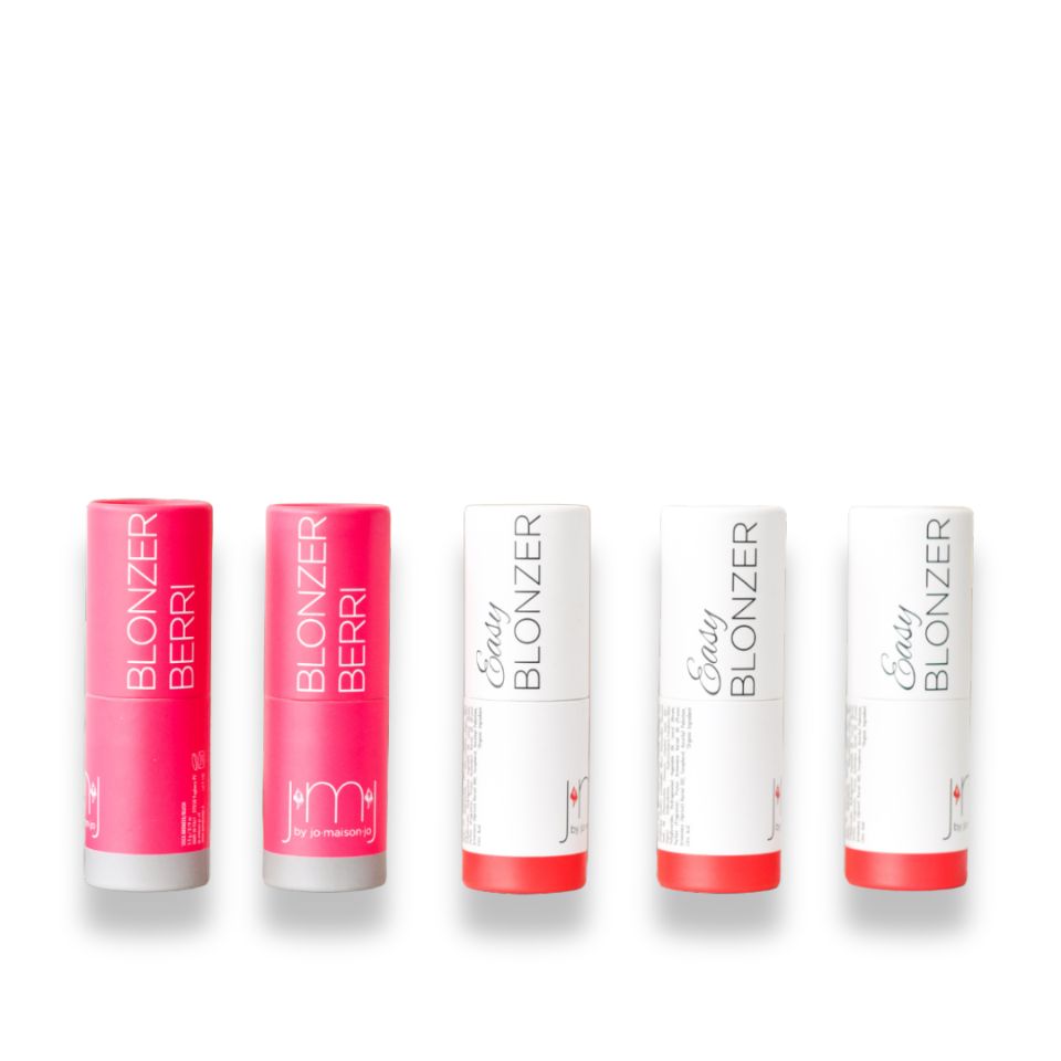 Cinque stick Blonzer cilindrici. Due rosa con "Blonzer Berri". Tre bianchi con "Easy Blonzer".
