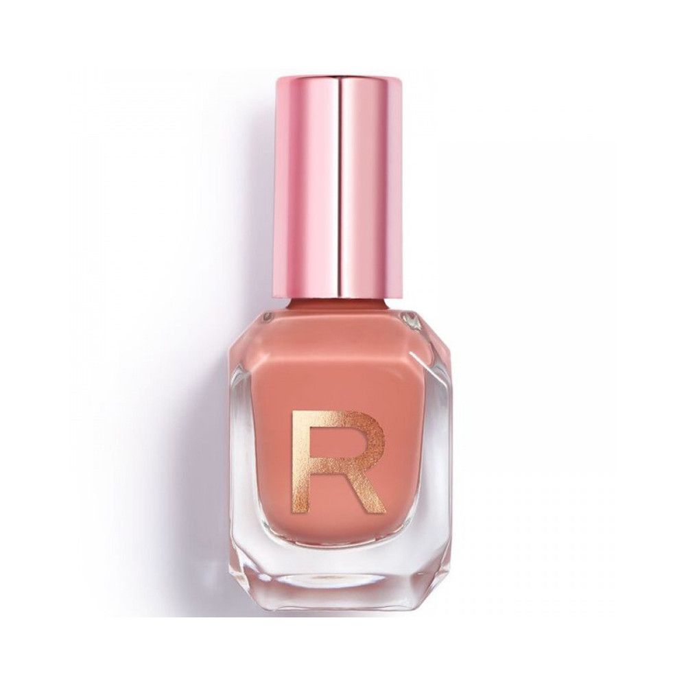 Nagellackflasche mit rosafarbenem Deckel. Der Lack ist pfirsichfarben. Auf der Flasche ist ein goldenes "R" zu sehen.