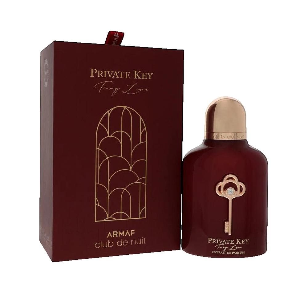 Dunkelroter Flakon mit goldfarbenem Verschluss und Schlüssel-Dekor. Daneben eine passende Schachtel mit goldfarbenem Schriftzug.