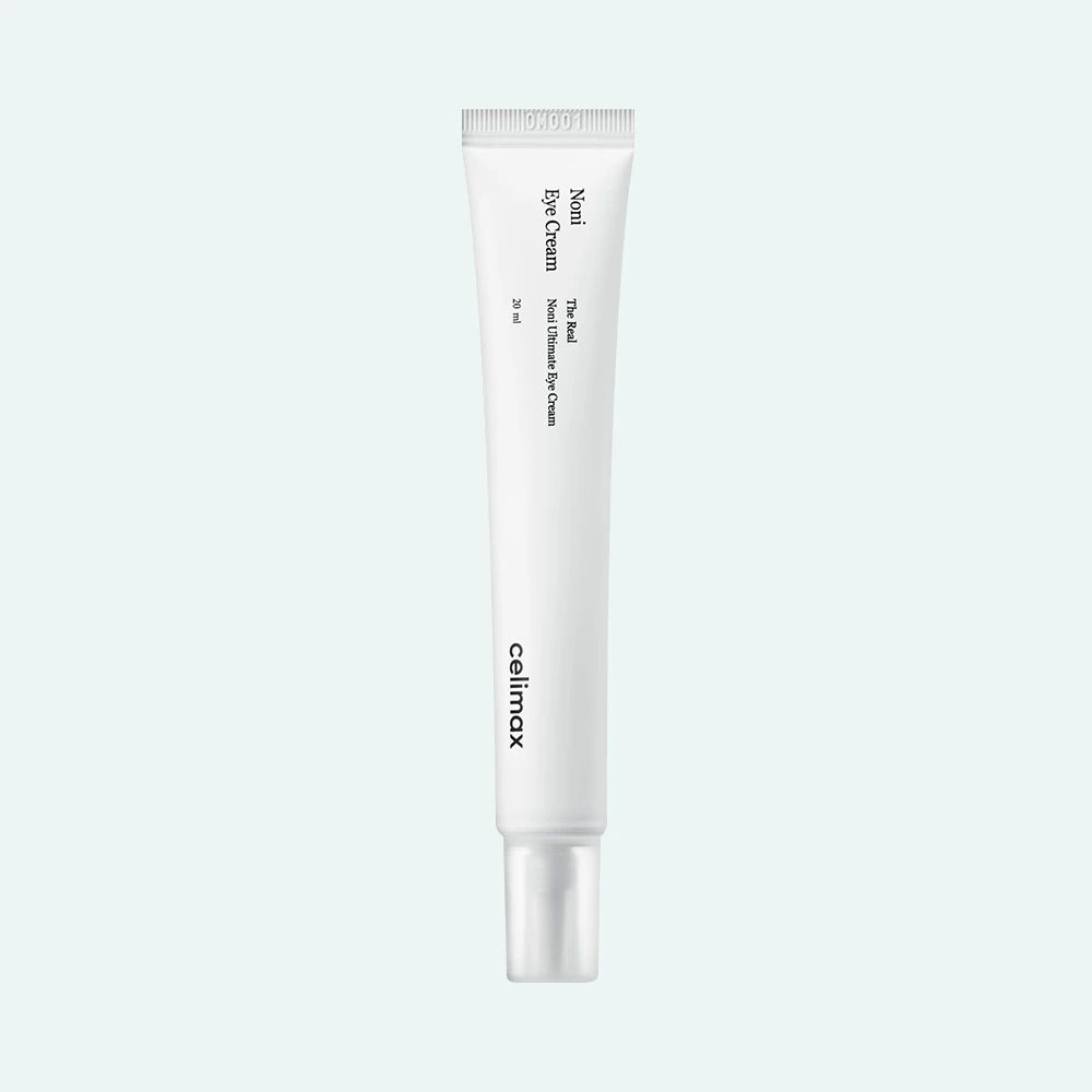 Weiße Tube mit Produktaufschrift. Marke: celimax. Produktname: Noni Eye Cream. Text in englischer Sprache.