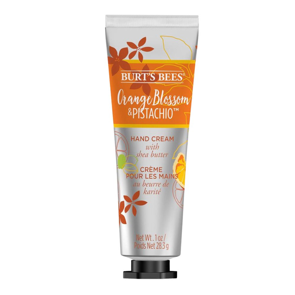 Handcreme-Tube mit Orangenblüten- und Pistaziengeschmack. Orangefarbener Schriftzug auf silbernem Hintergrund. Schwarzer Verschluss.