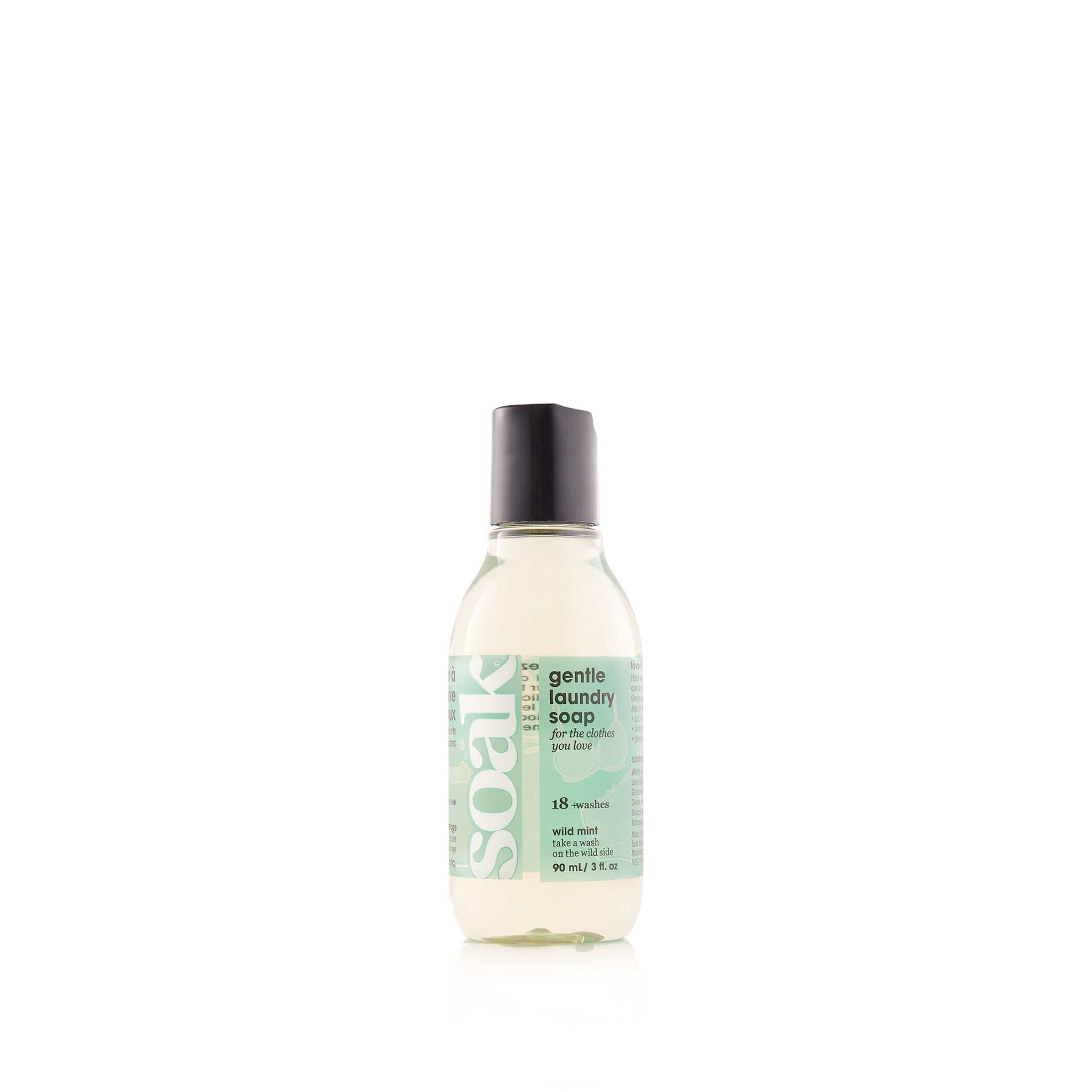 Klarflüssiges Waschmittel in einer Flasche mit schwarzem Deckel. Aufschrift: Soak, Gentle Laundry Soap, Wild Mint.