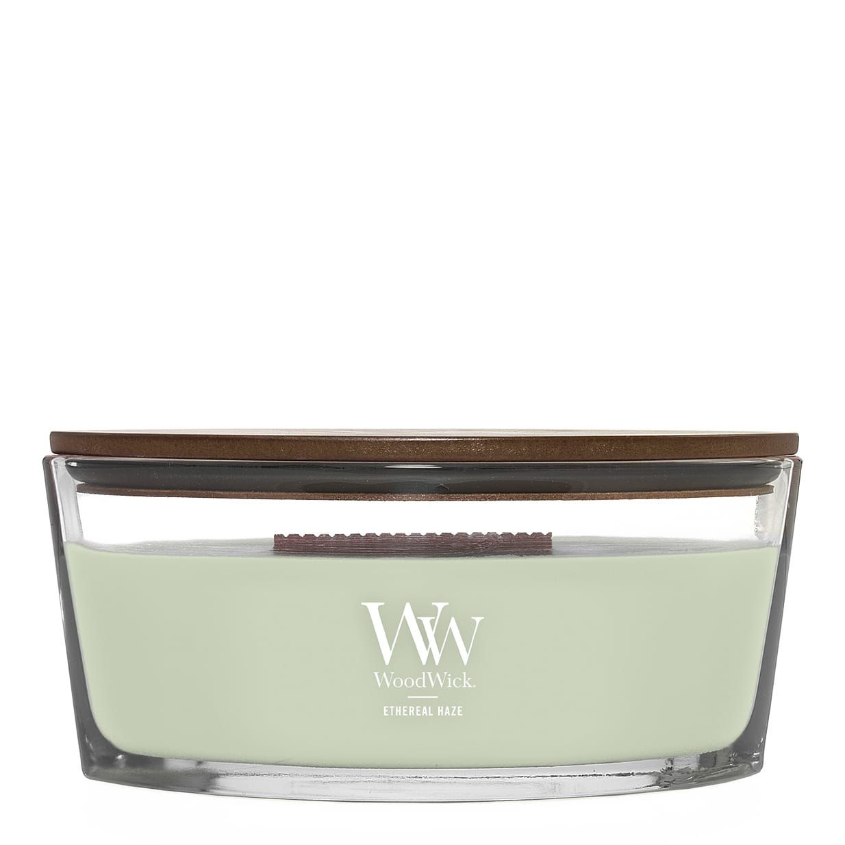 Ellipsenförmige Kerze mit Holzdeckel. Glasbehälter mit hellgrünem Wachs. Marke WoodWick, Text: Ethereal Haze.