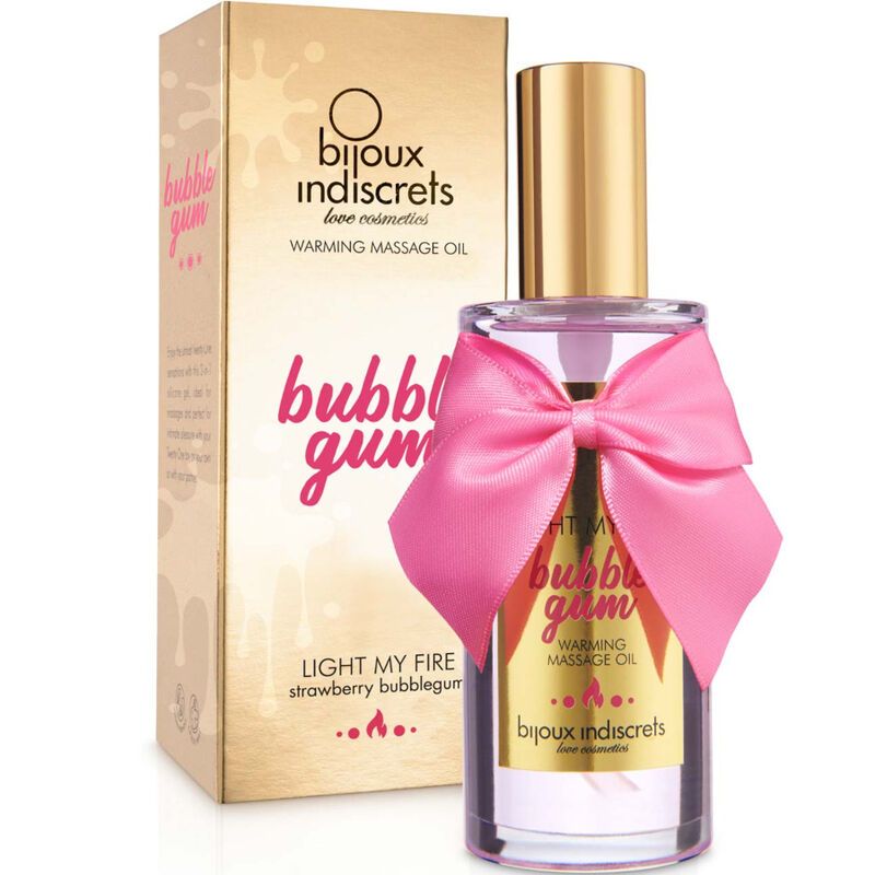 Massageölflasche neben passender Verpackung. Beide mit "Bubble Gum"-Design, rosa Schleife und goldenen Akzenten.