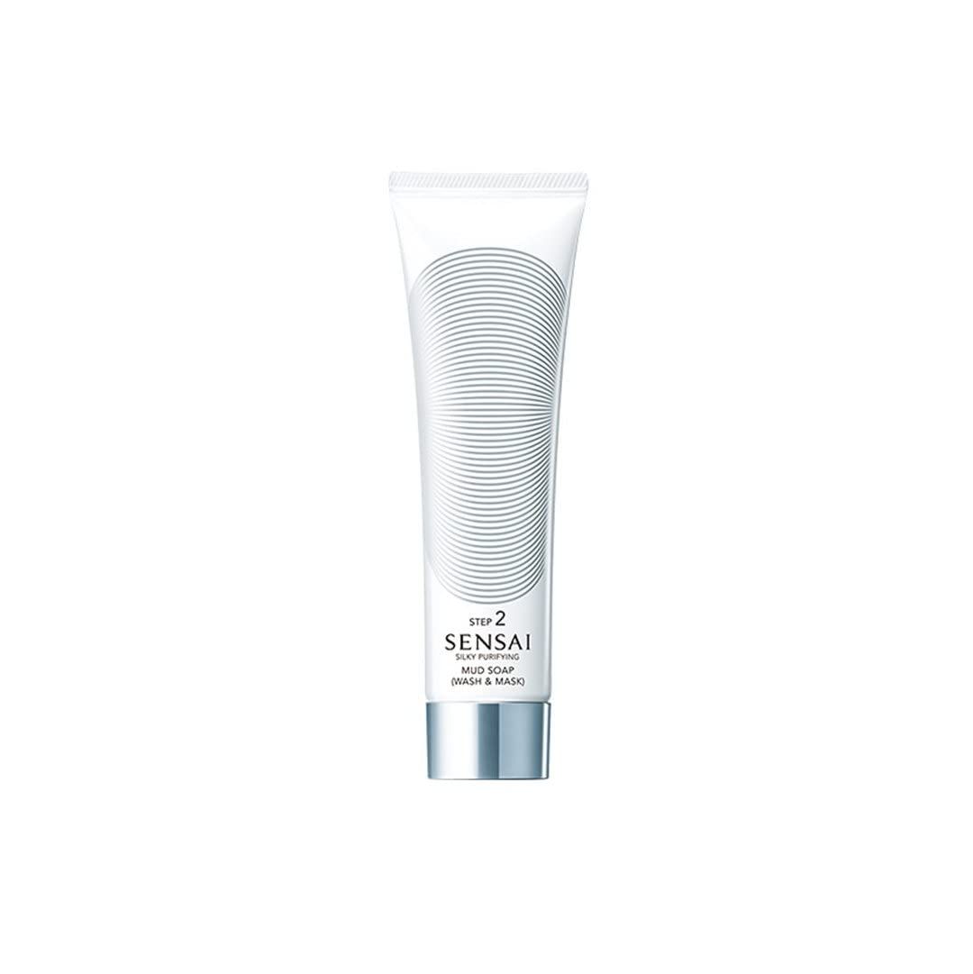 Weiße Tube mit grauen Linien. Text: SENSAI SILKY PURIFYING MUD SOAP (WASH & MASK).