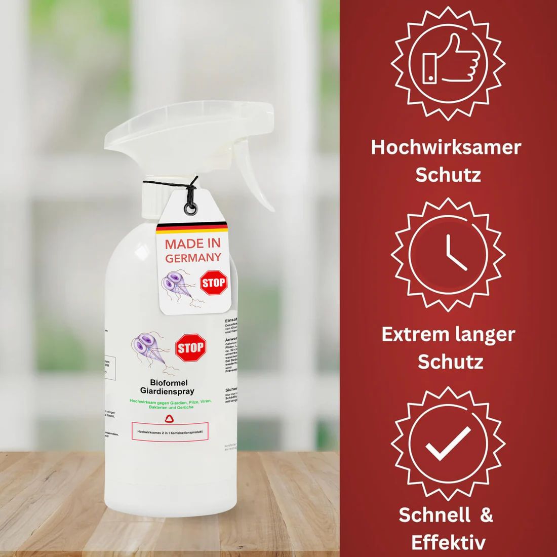 Weiße Sprühflasche mit Sprühkopf. Anhänger mit Aufdruck "Made in Germany" und "STOP". Text: "Bioformel Giardien Spray".