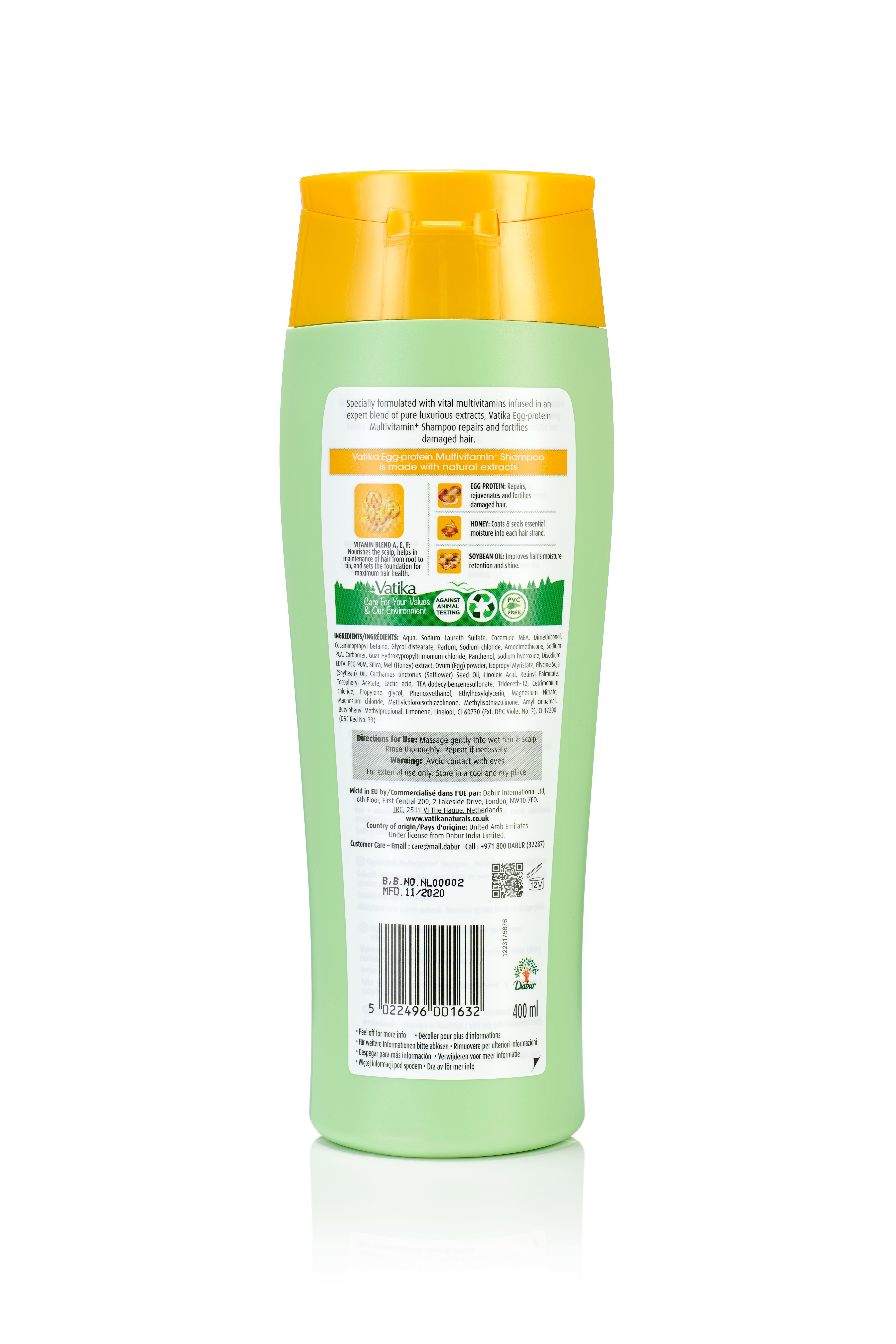 Rückseite einer grünen Shampoo-Flasche mit gelbem Deckel. Text und Symbole. 400 ml.