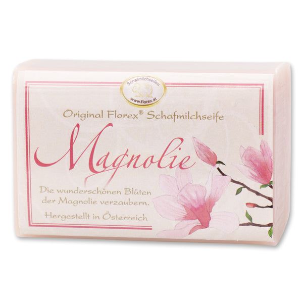 Rechteckige Schafmilchseife mit Verpackung. Aufdruck: Original Florex Schafmilchseife Magnolie, Blüten.