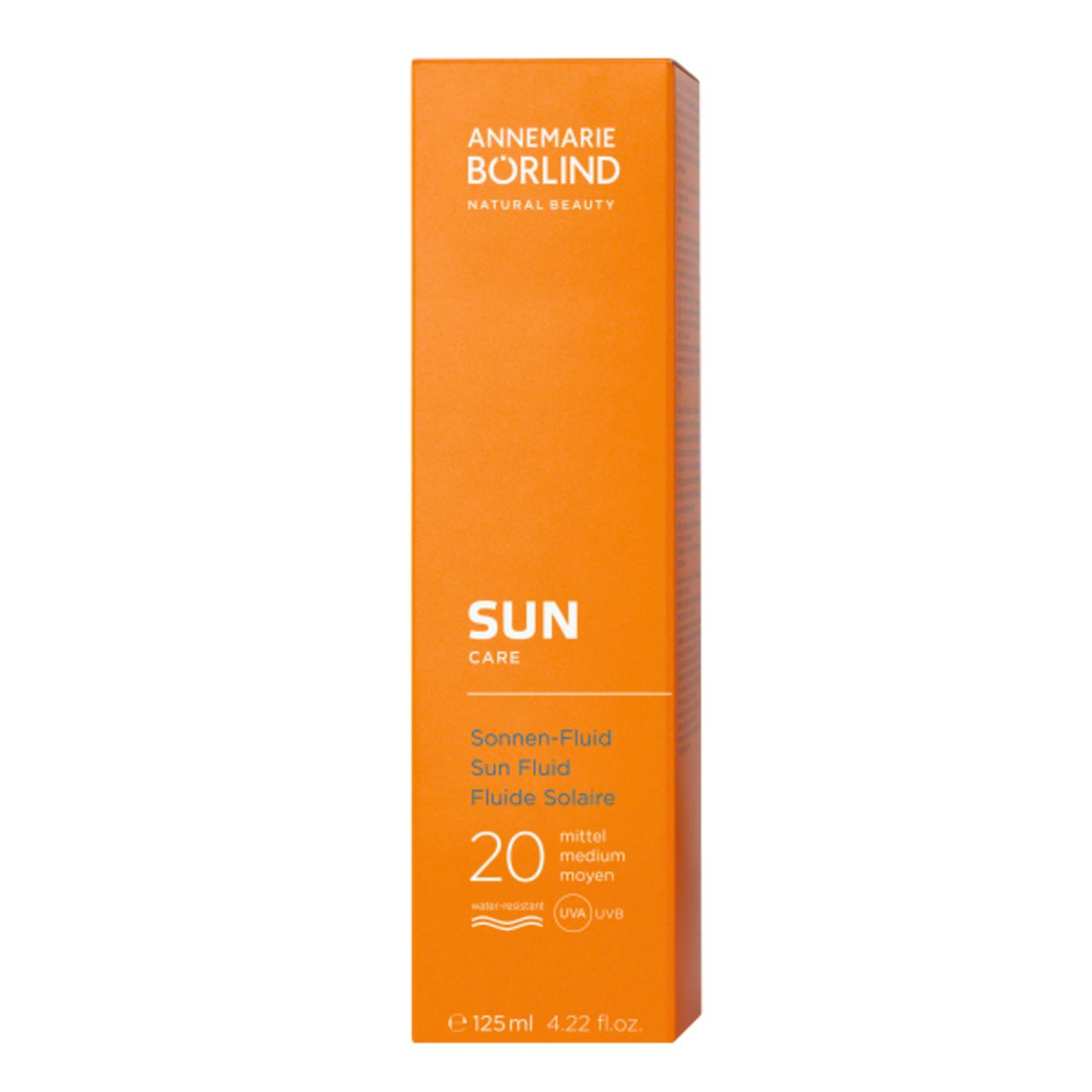 Orange Verpackung mit Sonnen-Fluid LSF 20. Marke: ANNEMARIE BÖRLIND. Text: SUN CARE, Sonnen-Fluid, 125 ml.