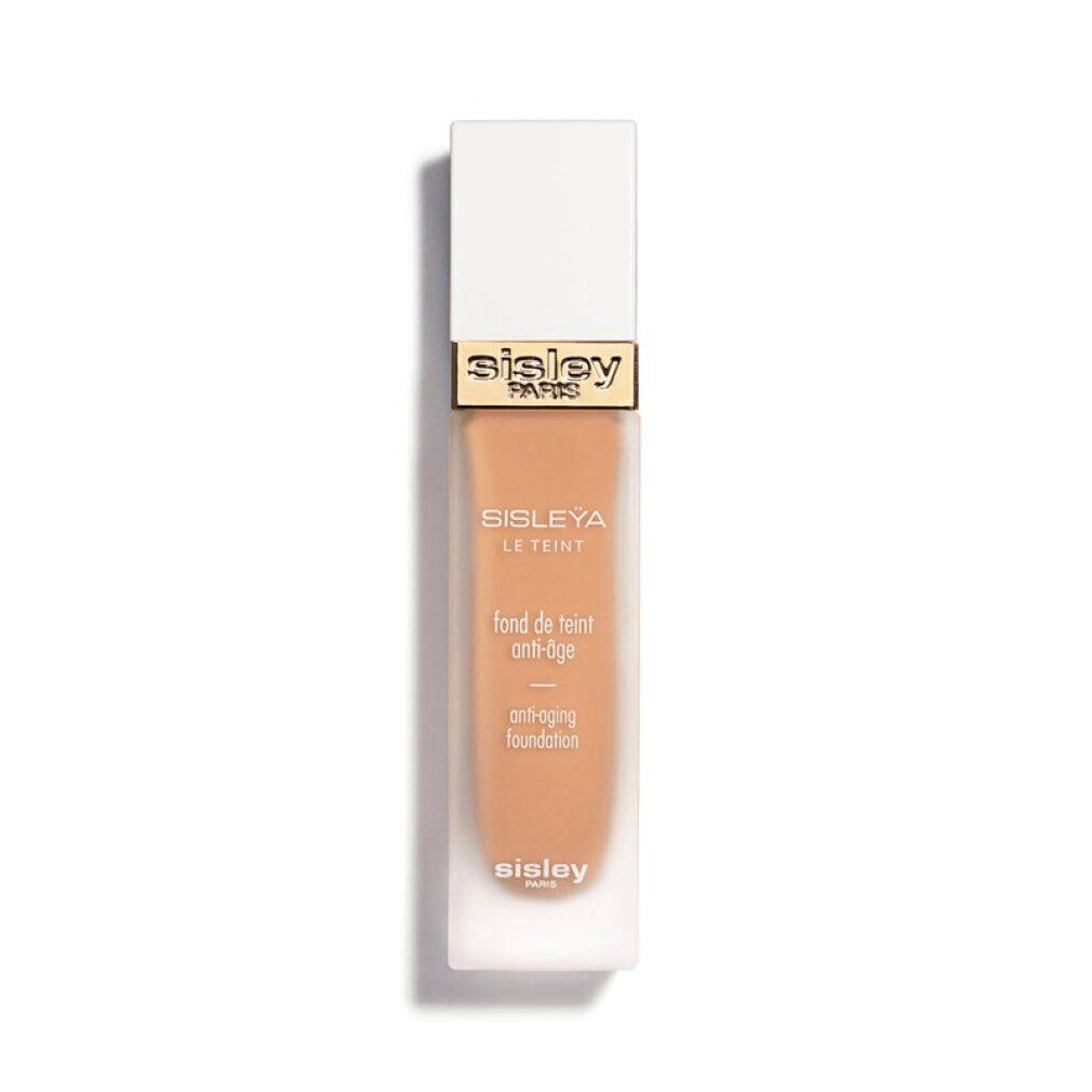 Sisley Sisleya Le Teint. Flakon mit beiger Foundation, weißer Deckel. Goldener Schriftzug. Anti-Aging-Foundation.