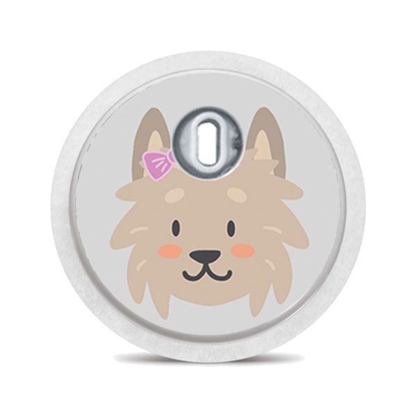 Runder Aufkleber mit einem Hundegesicht. Der Aufkleber hat ein Loch und einen Metallring.