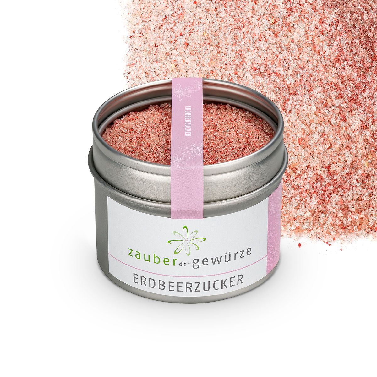 Geöffnete Dose Erdbeerzucker. Rosa Zucker. Etikett mit 'Zauber der Gewürze Erdbeerzucker'. Rosa Band. Streuung von Zucker daneben.