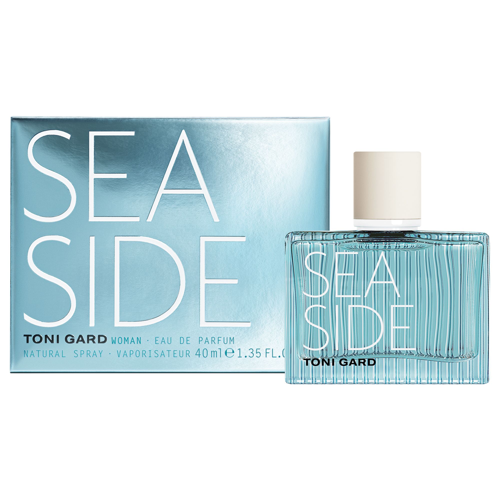 Parfümflakon und Schachtel. Flakon hellblau, Deckel weiß. Aufschrift SEA SIDE und TONI GARD. Schachtel silber.