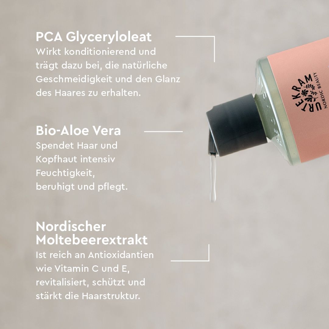 Flasche mit rosa Etikett und schwarzem Verschluss, aus dem eine weiße Flüssigkeit tropft.