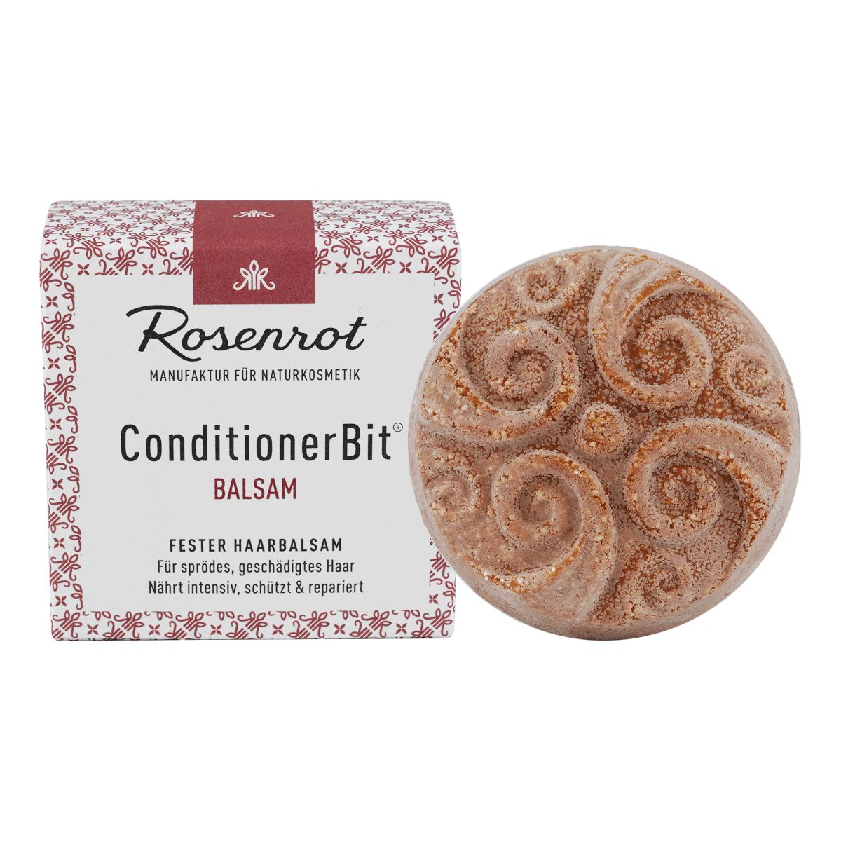 Runder, fester Haarbalsam neben Verpackung. Verpackung mit Markenlogo und Produktbezeichnung. Balsam mit spiralförmigem Muster.