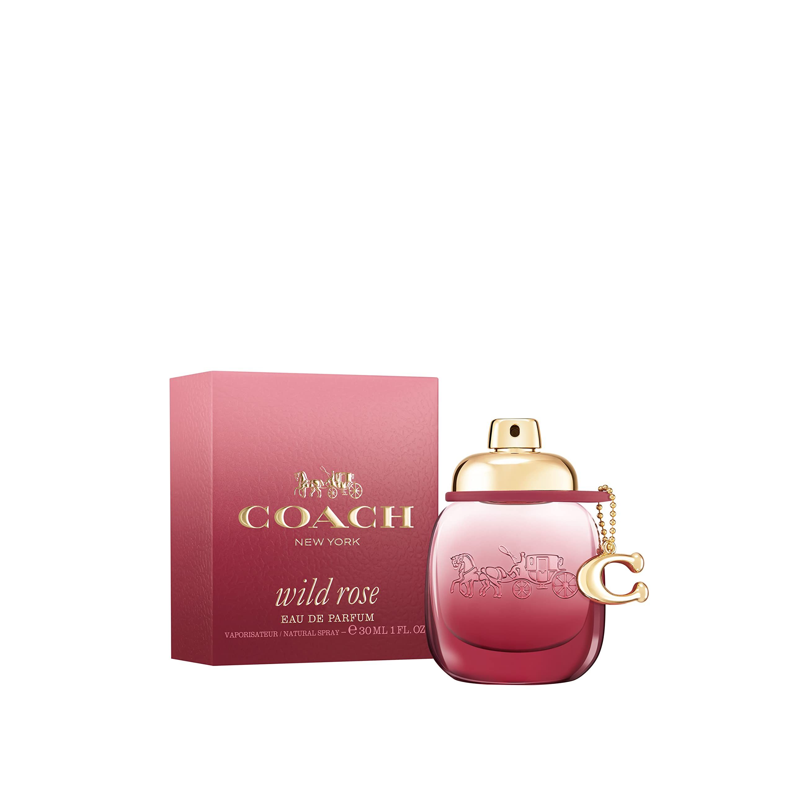 Coach Wild Rose EdP Nat. Spray. Flakon und Verpackung in Rosa. Goldfarbener Verschluss und Anhänger.
