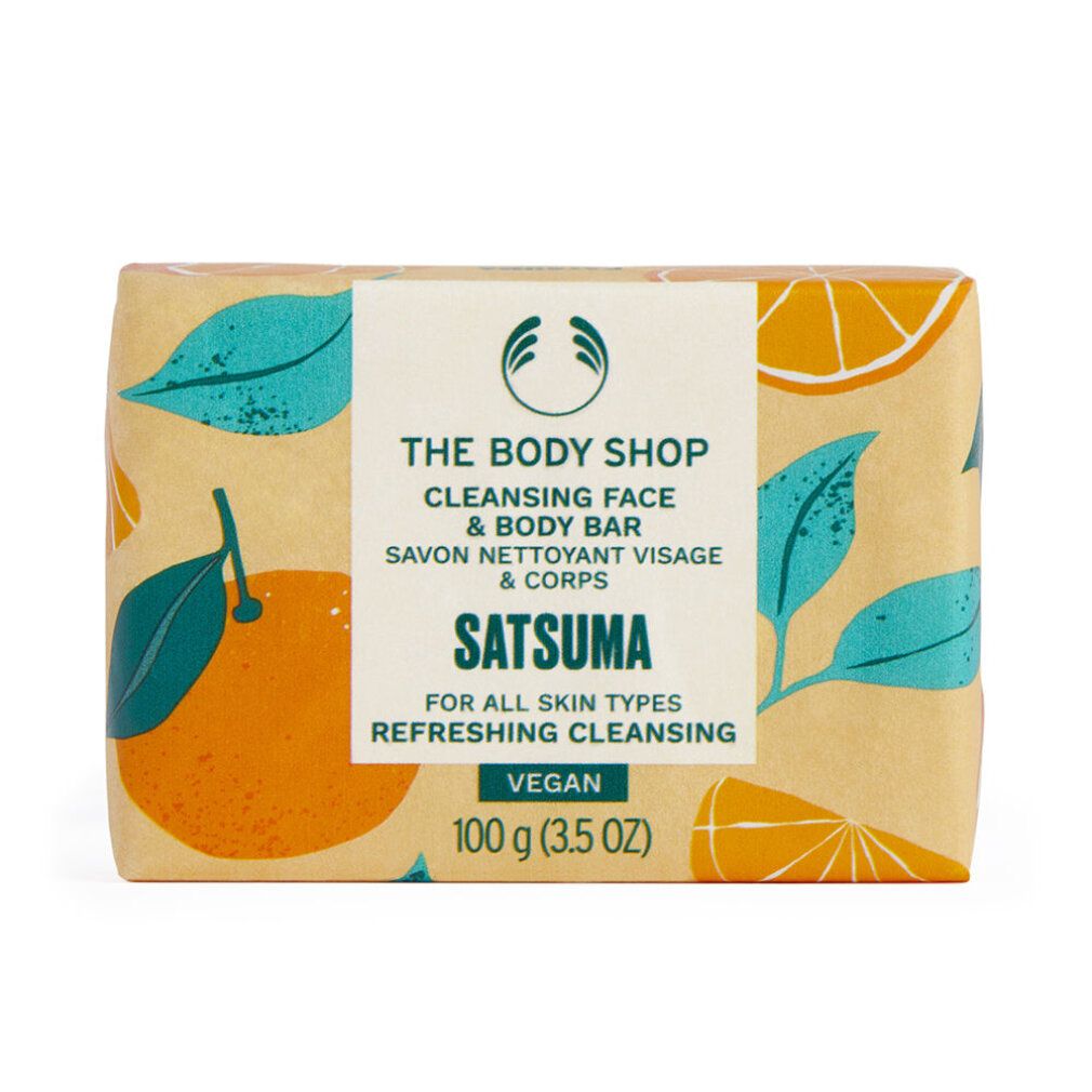 Seifenstück mit Papierverpackung. Aufdruck: Satsuma, The Body Shop, Cleansing Face & Body Bar. Vegan. 100 g.