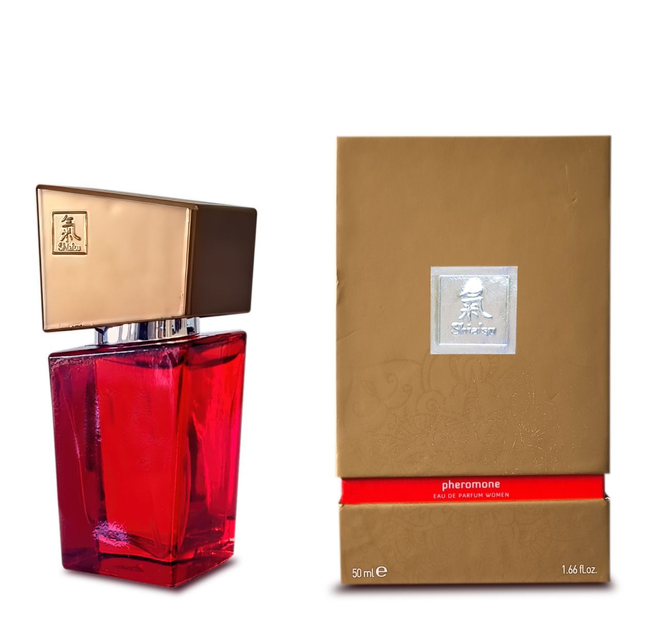 Rote Glasflasche neben einer goldenen Schachtel mit rotem Band.