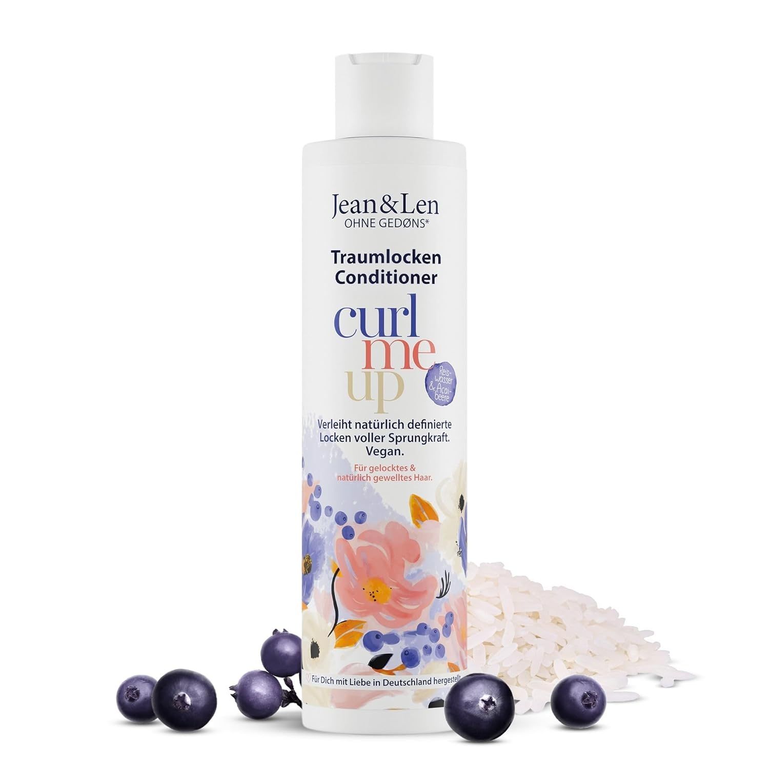 Flasche Jean & Len Traumlocken Conditioner. Beeren und Reis liegen vor der Flasche.