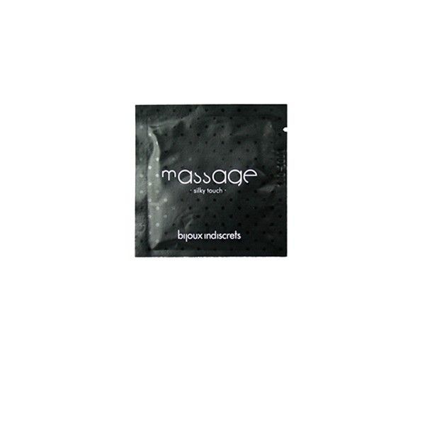 Kleine schwarze Verpackung mit Punkten, 'massage silky touch'.